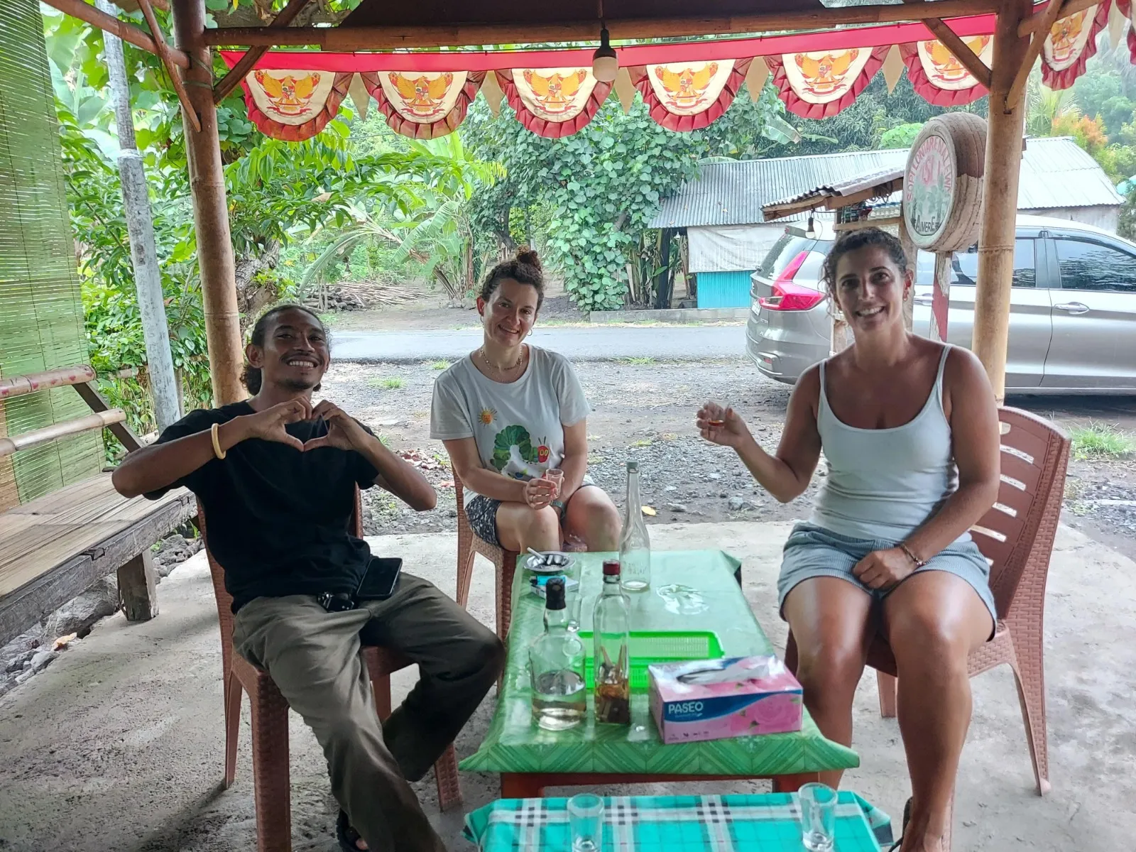 Tasting locally distilled arak with villagers in Aimere